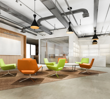 A modern office space with a colorful carpet in need of professional carpet cleaning services.