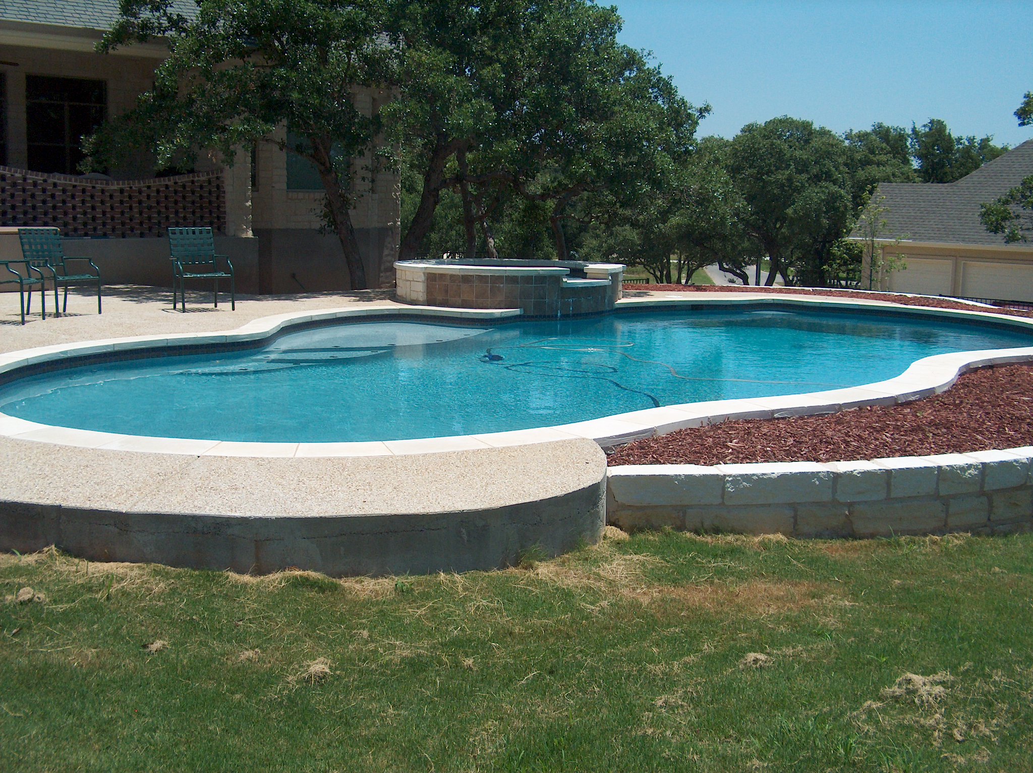 Relaxing outdoor space featuring a modern pool.